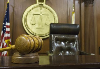 Hammer and gavel near judges chair in court